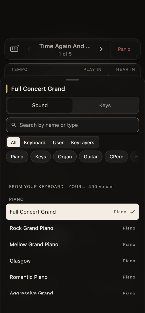 The sound picker in KeyLayers on a phone: layer 1’s sound, a search field, filters for All, Keyboard, User and KeyLayers, the keyboard’s own categories, and its own voices listed under Piano with Full Concert Grand picked.